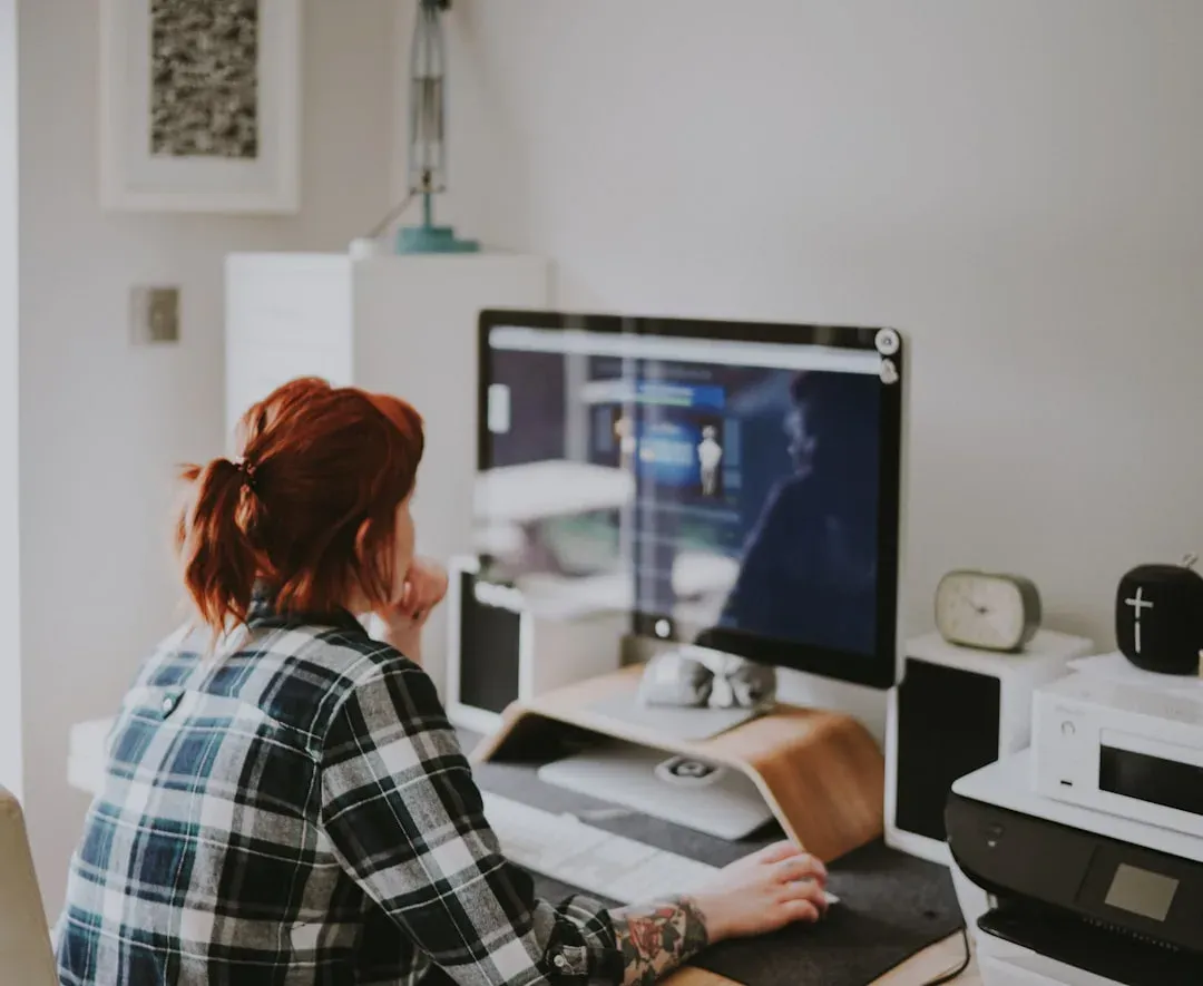 individual working on laptop in a shared living area